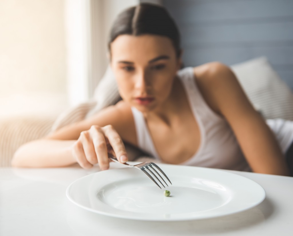 a woman with an eating disorder