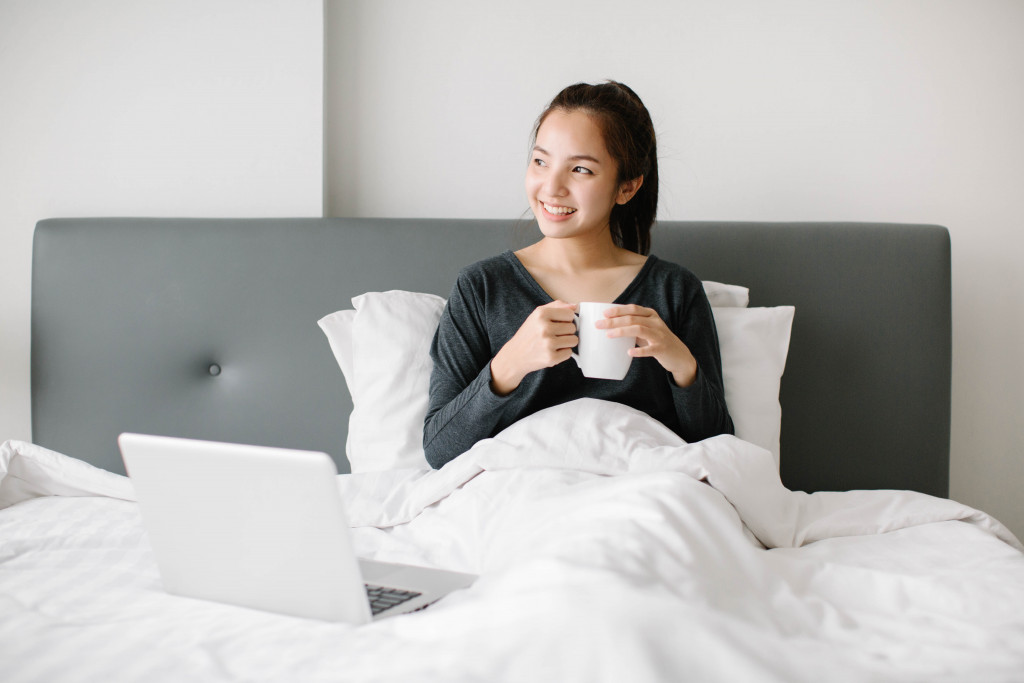 woman in bed feeling relaxed
