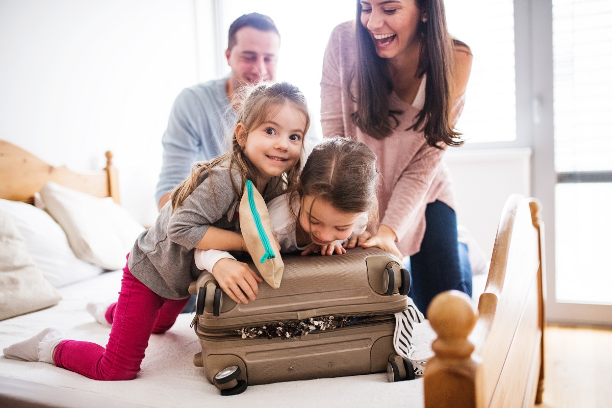 young family packing for a trip